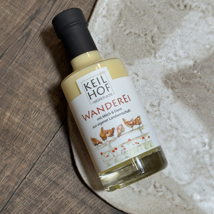 Ausgepackte Tirol Geschenkbox mit Keilhof Wanderei Eierlikör 0,2 l Essenz der Alpen Tiroler Schneefl