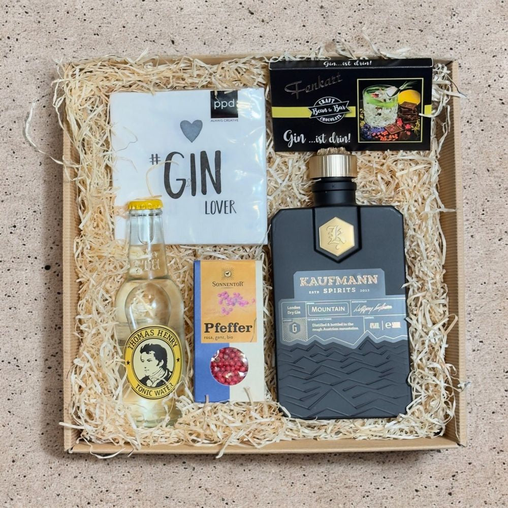 Gin Geschenkset mit Kaufmann Mountain Gin Thomas Henry Tonic Fenkart Gin Schokolade rosa Pfeffer und Gin Lover Servietten in Geschenkverpackung