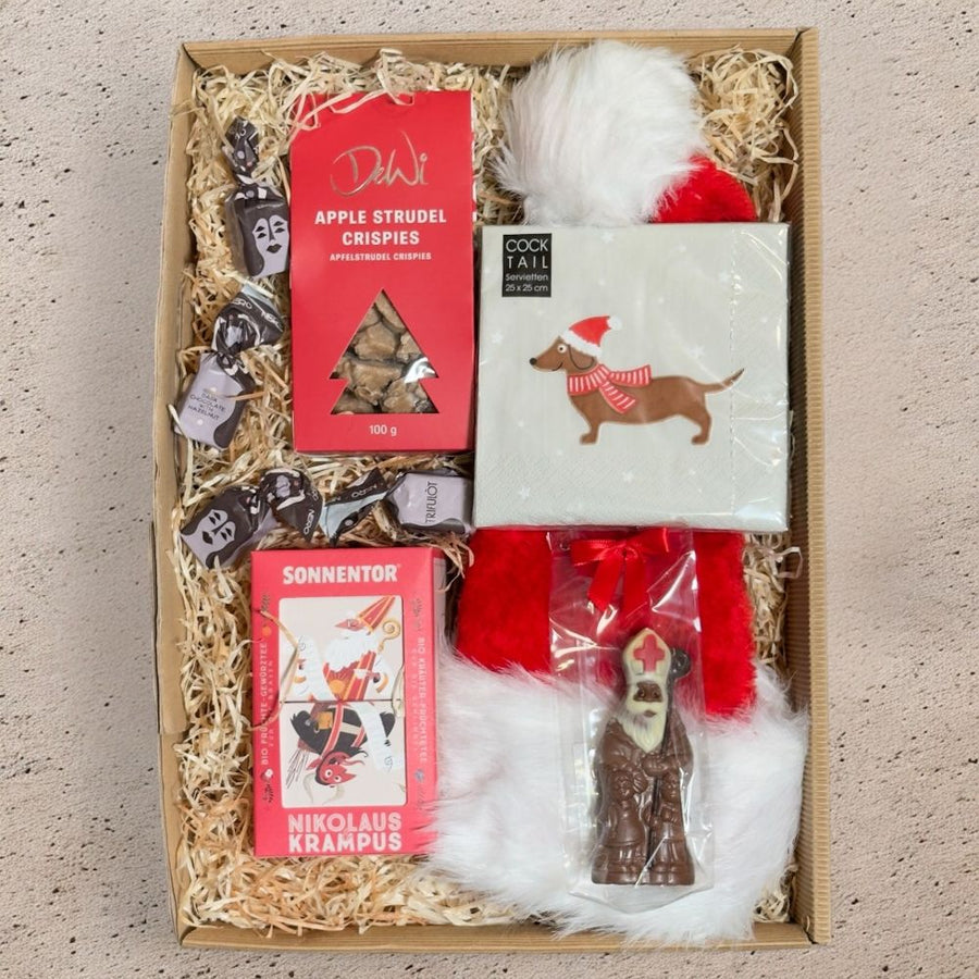 Nikolaus Geschenkset mit Sonnentor Nikolaus Krampus Tee Mini Bischof Apfelstrudel Crispies Tartufo Santa Mütze und Dackel Servietten in Geschenkverpackung